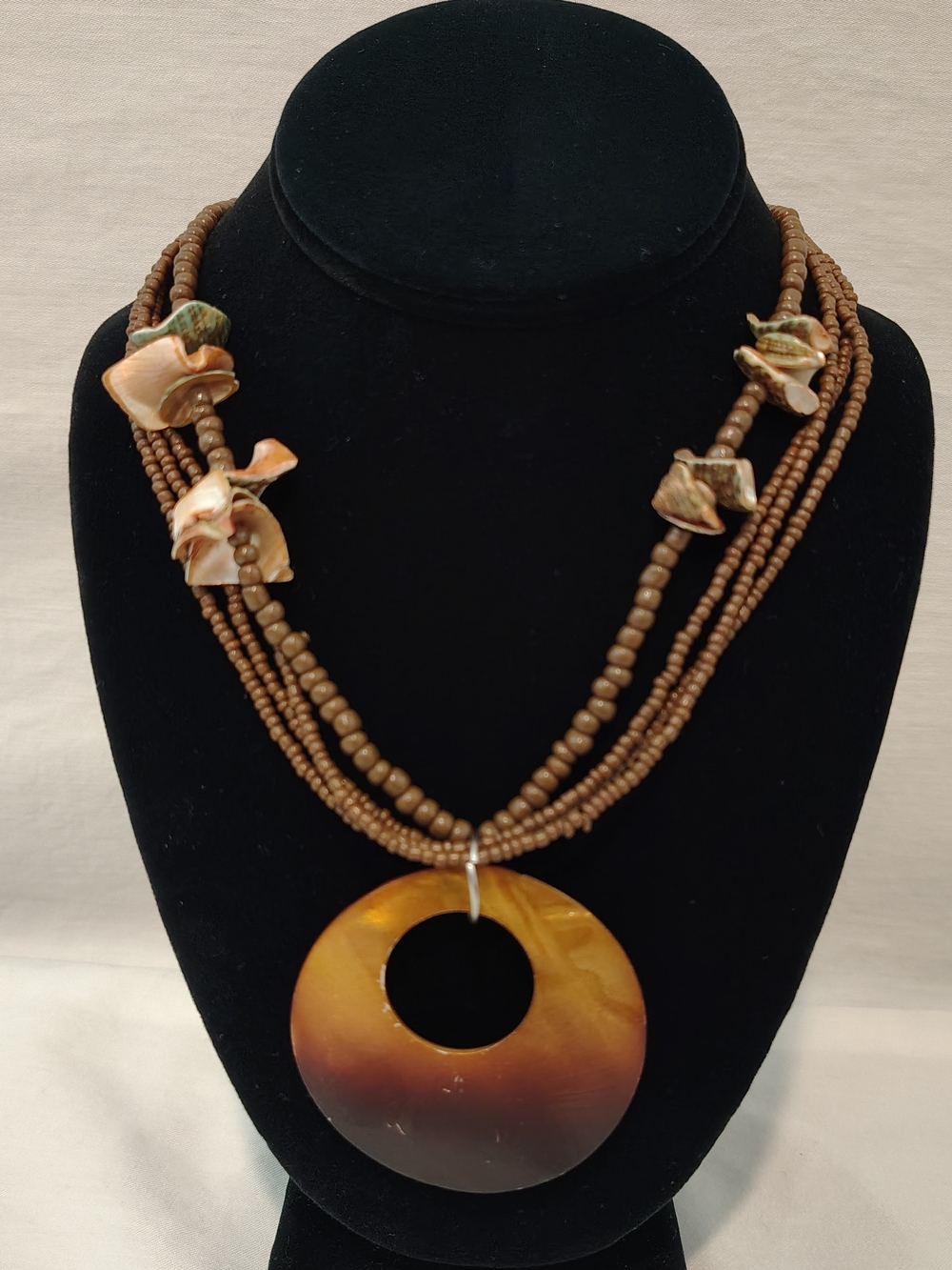 Brown Multi-Strand Beaded Necklace with Shell Pendant